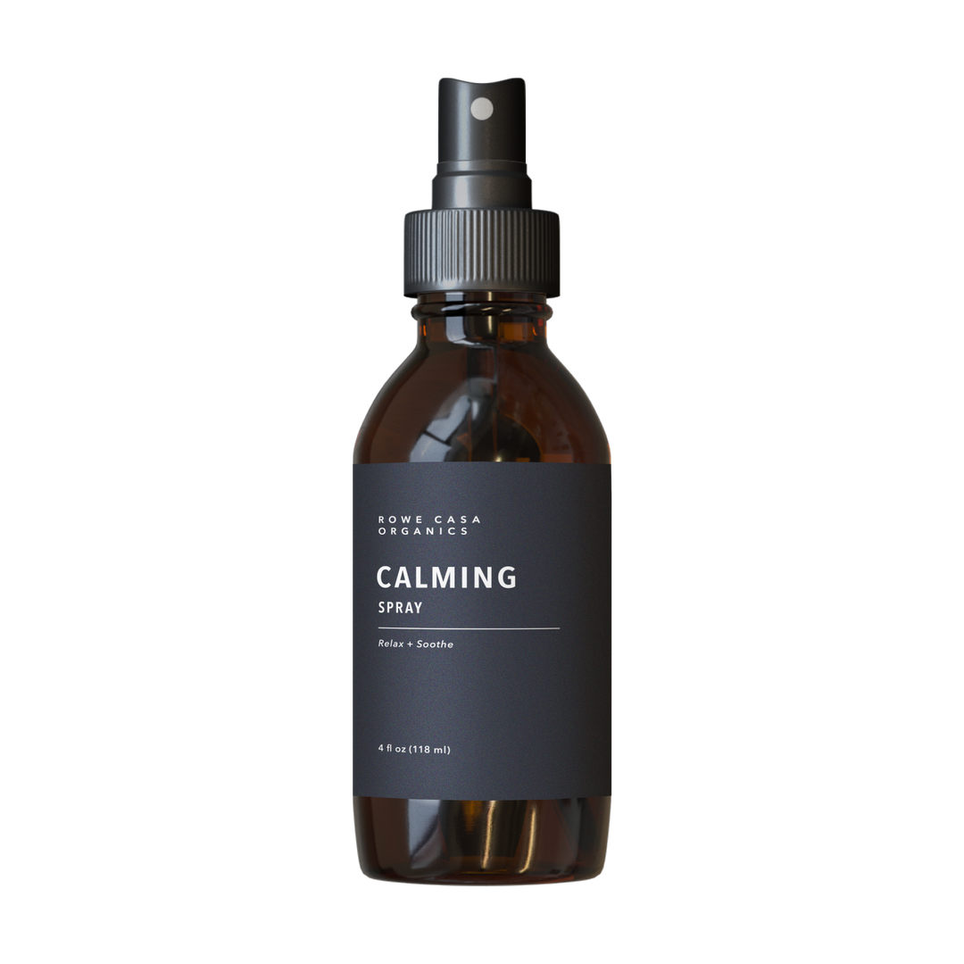 Brown 4 oz spray bottle labeled “Calming Spray” with black and white text, black nozzle and cap.