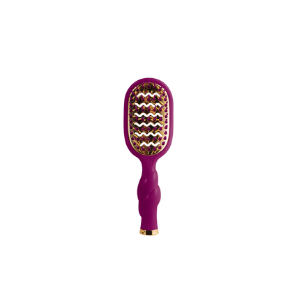 The Mini Vented Hair Brush - Mulberry has a purple body, gold accents, and a vented, curved design. Available in mini size.