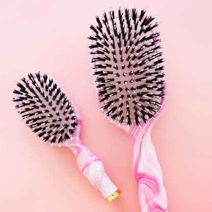 Two Pinch Me! Tie Dye Pink Boar Bristle Hair Brushes with glossy, curved handles, in regular and travel sizes.