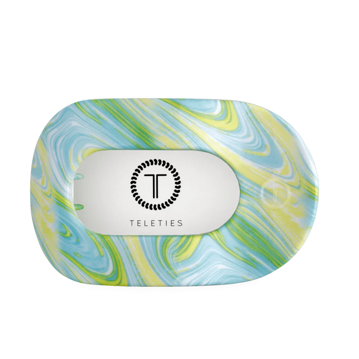 Flat Round Hair Clip | Summer Tie Dye Edition in blue, green, yellow swirl with Teleties logo; available in small and large.