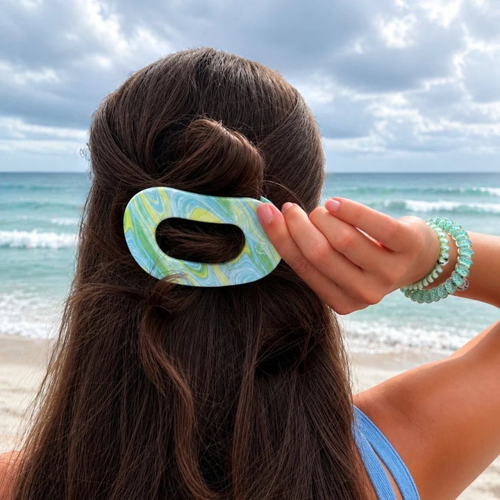 Flat Round Hair Clip | Summer Tie Dye Edition shown in blue, green, and yellow. Available in small, medium, and large sizes.
