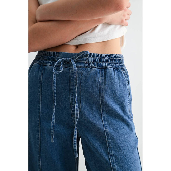 HIGH-RISE WIDE JOGGERS: NAVY EYES / L. High-rise lyocell joggers with elastic drawstring waist and vertical seam detailing.