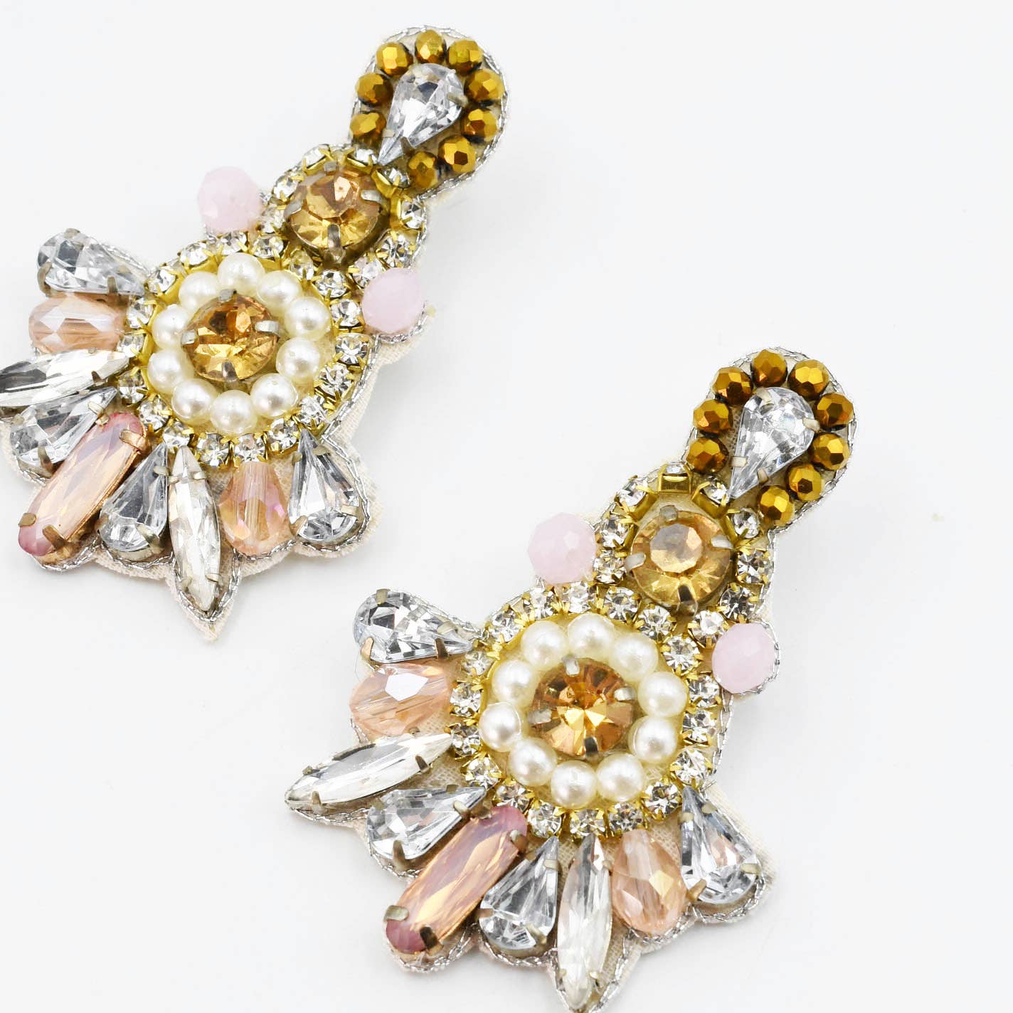 Gold chandelier earrings with pearl, pink, and clear crystals in floral fan design. Available in small, medium, and large sizes.