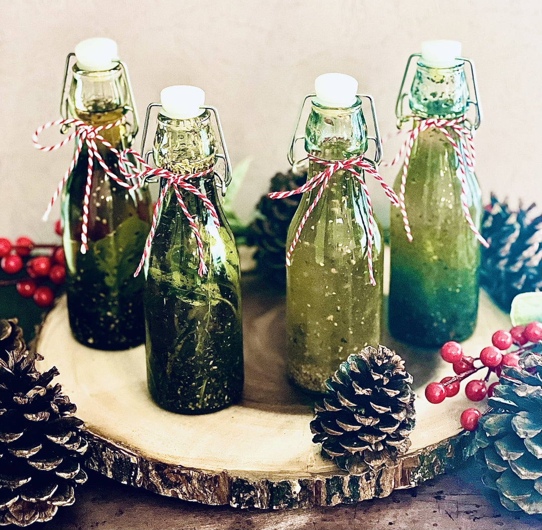 Four bottles of Toasted Garlic Dipping Oil Seasoning with red and white string. Sizes available: 8oz, 12oz, 16oz.