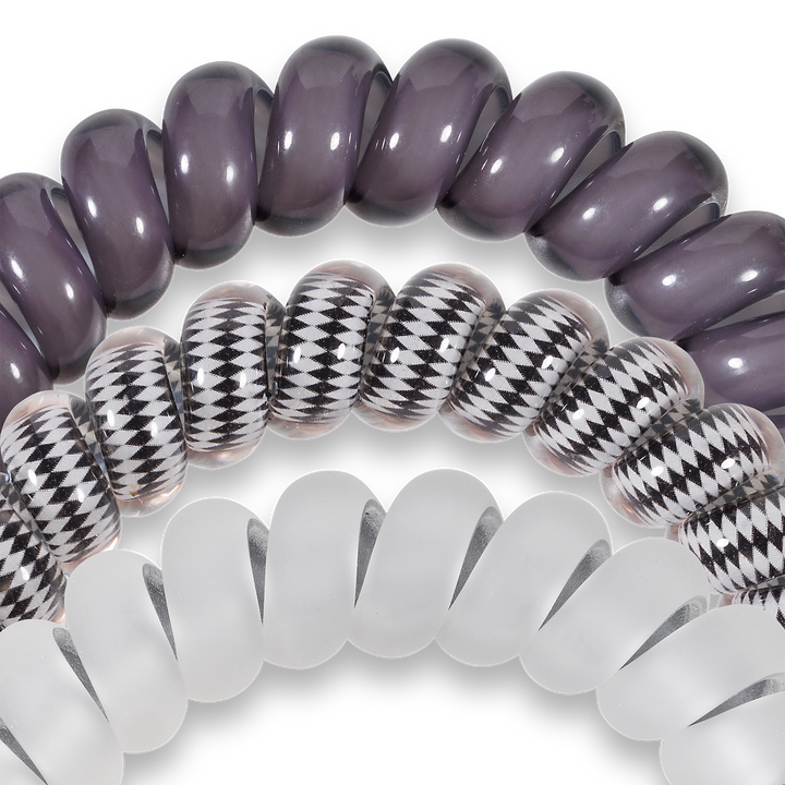 Three large Spiral Hair Coils in assorted colors and patterns, offering a strong grip or wearable as stylish bracelets.