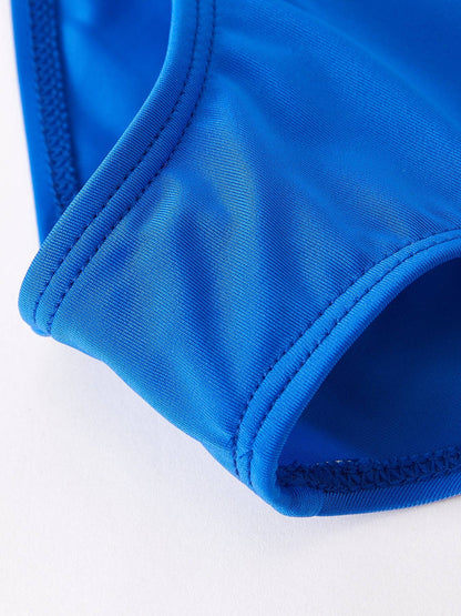Bright blue "Bow" Swimsuit with curved seams and detailed stitching. Available in sizes XS–XL.