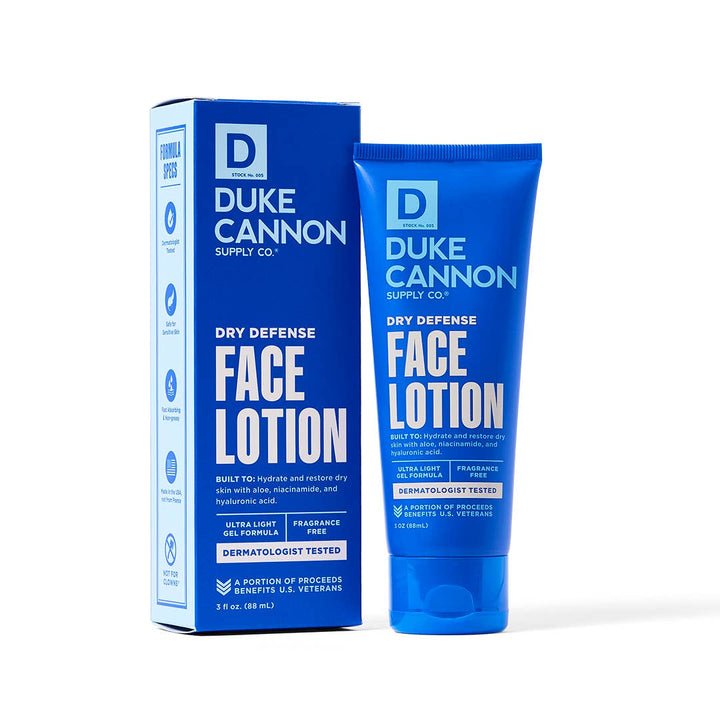 Blue tube of Dry Defense Face Lotion, moisture-replenishing, fragrance-free, for dry skin. Sizes: 1.7 oz and 3.4 oz.