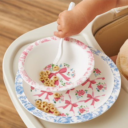 Itzy Bistro™ 4-Piece Dining Set bowl with floral and pink ribbon patterns. Available in toddler sizes.