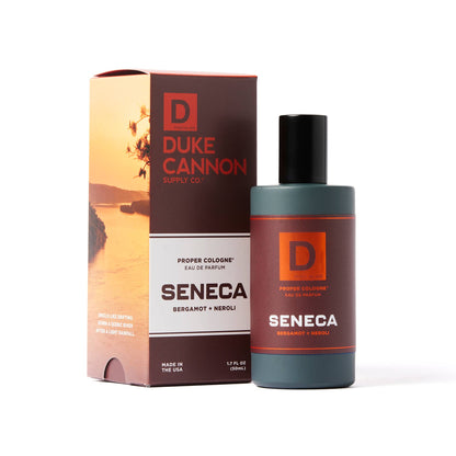 Proper Cologne- Seneca by Duke Cannon: dark bottle, orange label, aquatic scent. Available in 1.7 fl oz size.