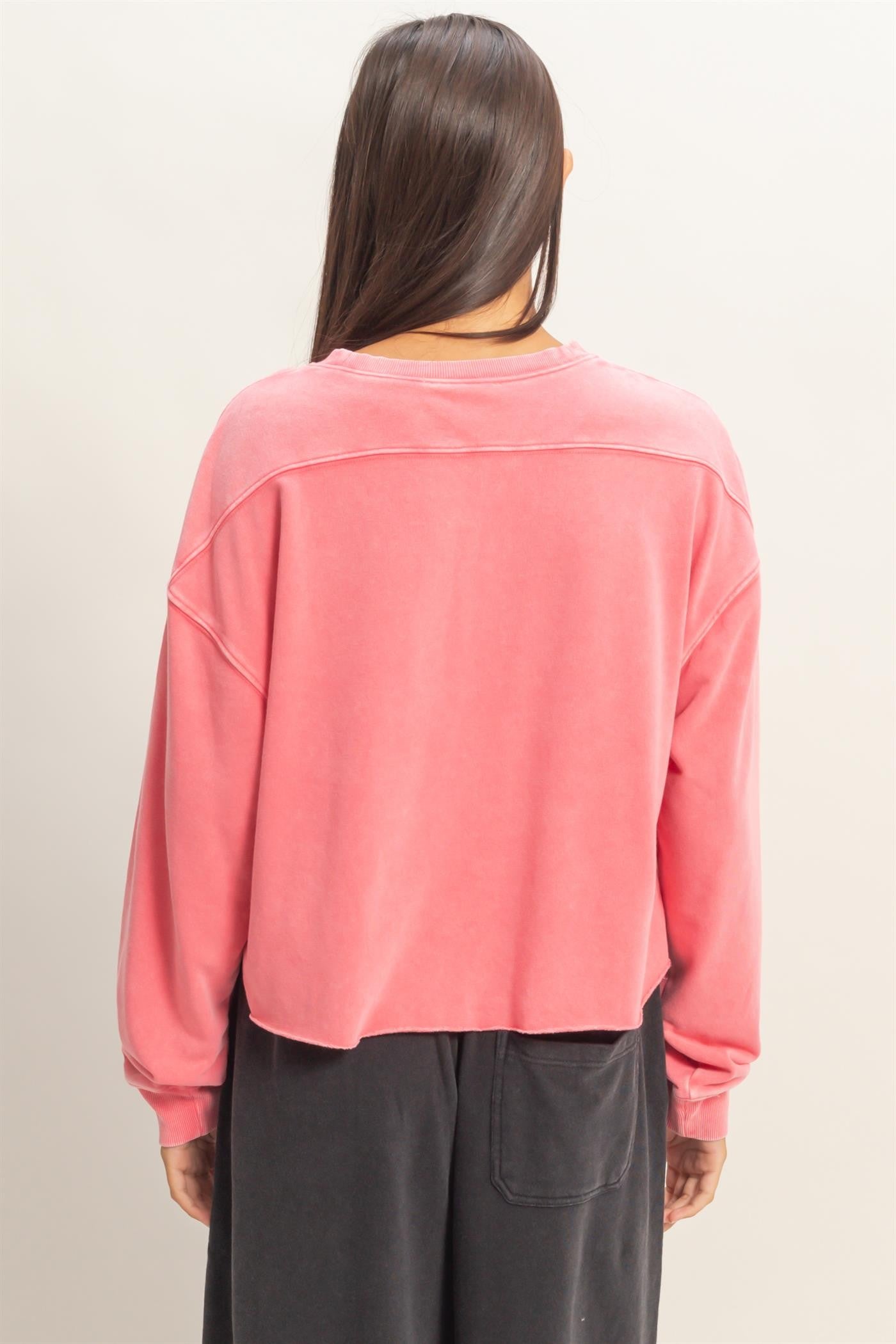 Cropped Mineral Wash Sweatshirt in coral pink, back view. Available sizes: XS-XL.