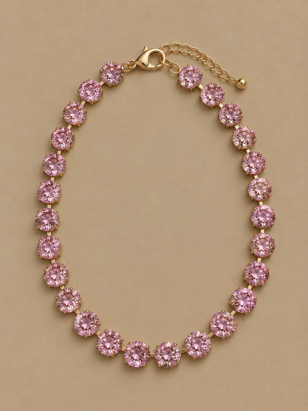 Gemmies Round Stones Necklace in light pink, featuring a single row of round stones and a lobster clasp closure.