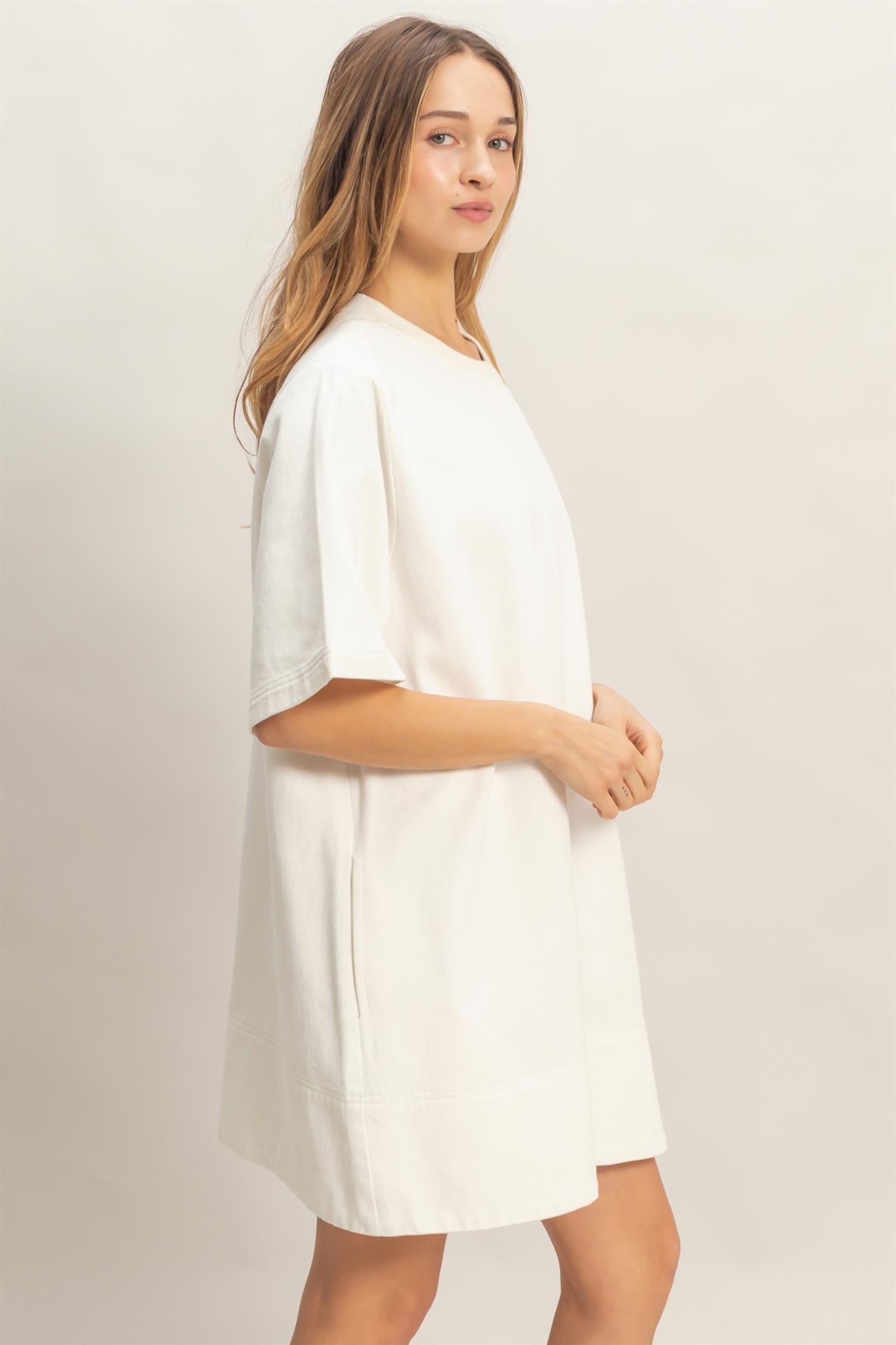 White Crew Neck Denim Tunic, loose-fitting and knee-length. Available in sizes XS–XL.