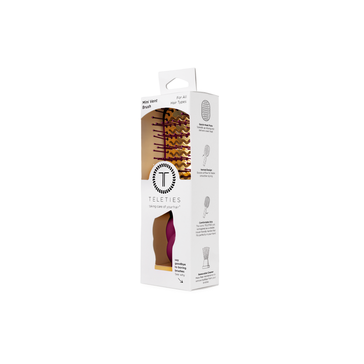 Mini Vented Hair Brush - Mulberry in a white box with clear window, compact size, purple and pink handle and bristles. Available in mini size. Product details on box side.