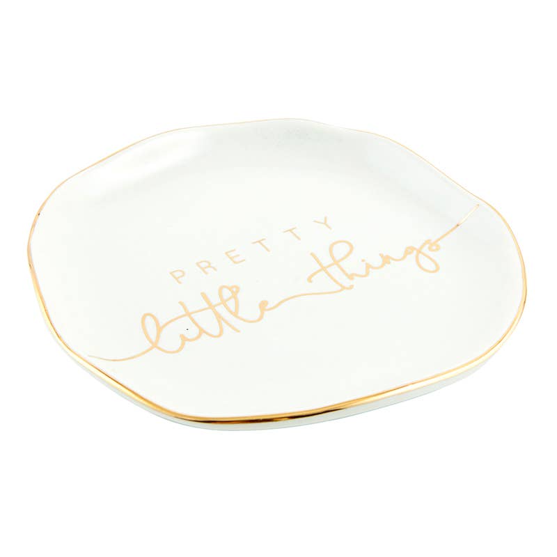 Small white ceramic trinket tray with gold trim and "Pretty Little Things" in gold cursive. Size: small.