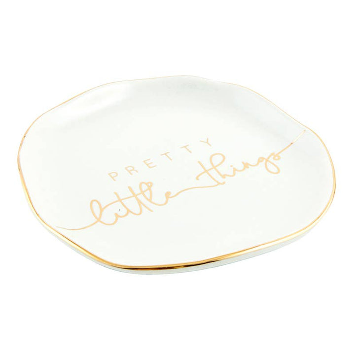 Small white ceramic trinket tray with gold trim and "Pretty Little Things" in gold cursive. Size: small.