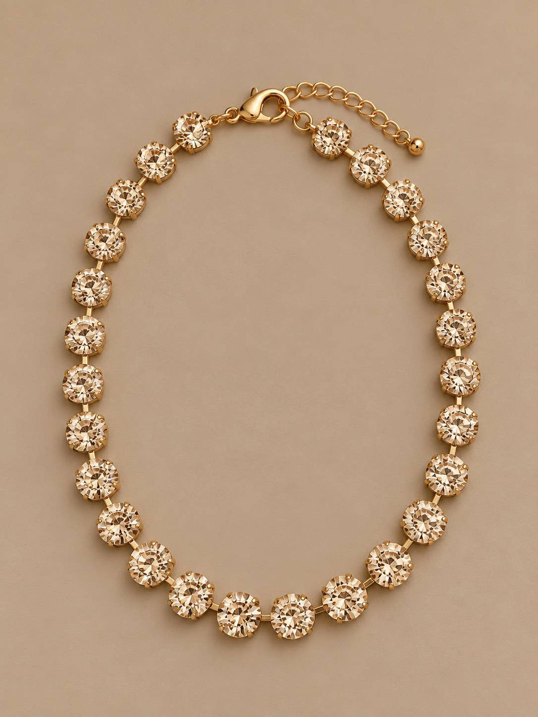 Gemmies Round Stones Necklace in champagne, featuring gold-toned, round faceted stones with an adjustable lobster clasp.