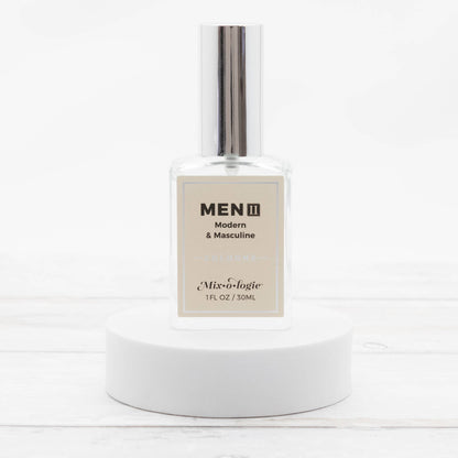Men’s II (Modern & Masculine) Cologne Spray in a clear glass 30 mL bottle with shiny silver cap. Available in 30 mL size.