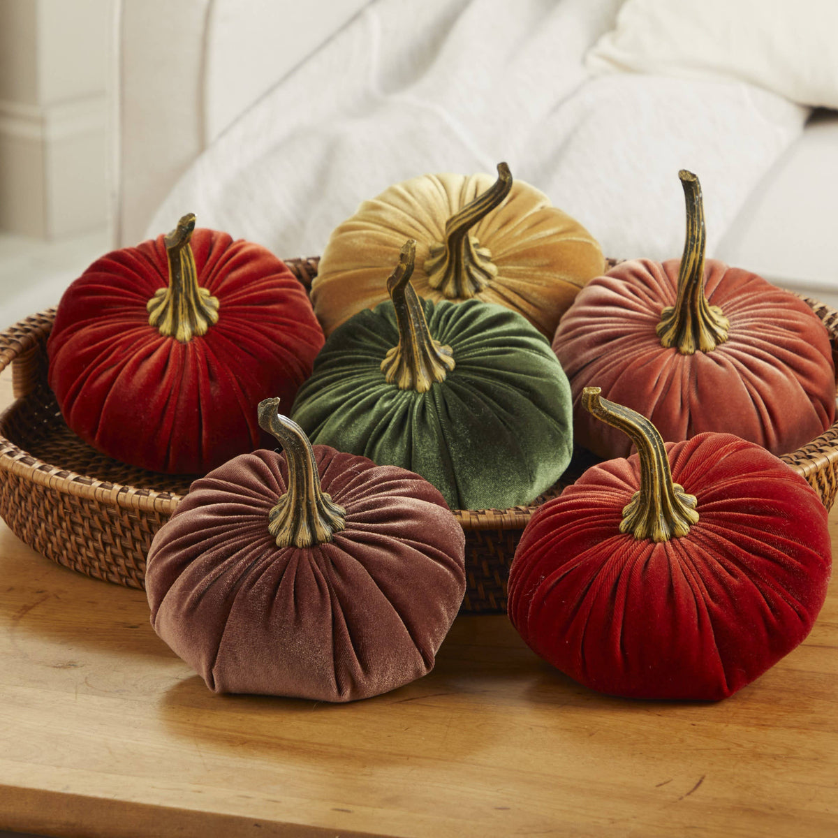 Six large fern-colored velvet pumpkins in a woven basket, available in large size; ideal for Thanksgiving or Halloween table decor.