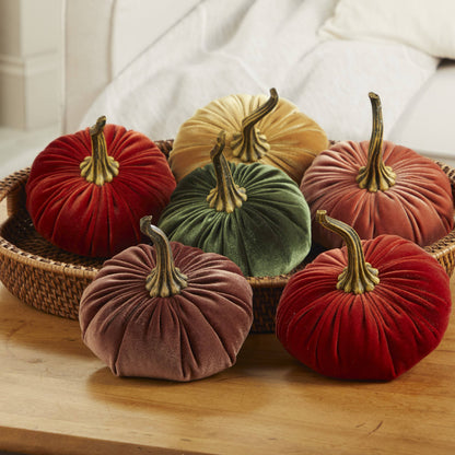 Set of six large velvet pumpkins, including pink, arranged in a wicker basket; available in large size.
