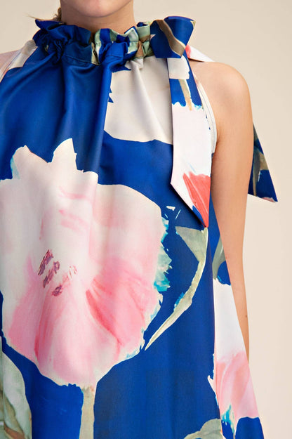Royal Mini Dress with sleeveless design, floral print, ruffle neck tie. Available in sizes XS-XL.
