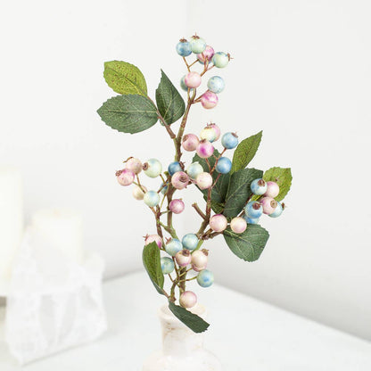 19″ Artificial Spring Mix Plump Pastel Berries Stem with green leaves and clusters of small, round pastel berries in pink, blue, and white. Size: 19 inches.