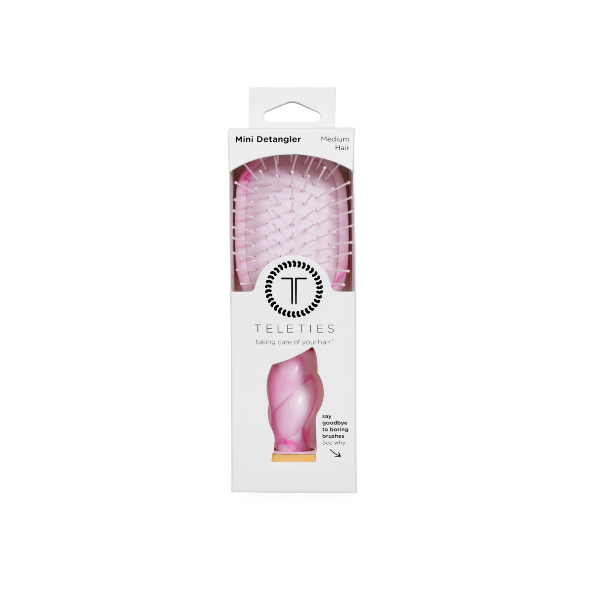 Pink Mini Detangler Brush in medium size, visible through a clear window in white TELETIES packaging with branding and brief product details.
