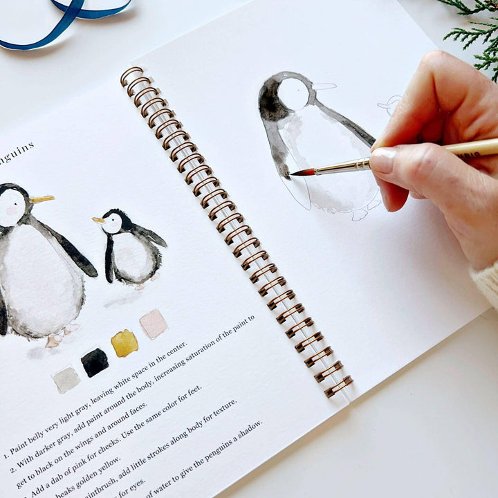 Winter watercolor workbook, a spiral-bound guide with step-by-step instructions.
