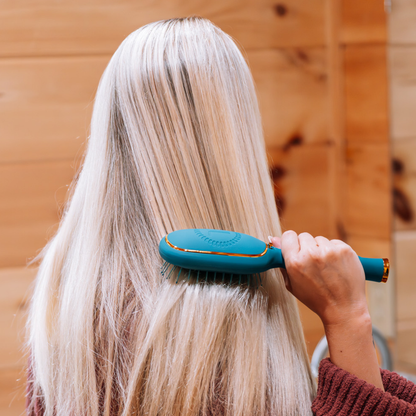 Detangler Hair Brush for Medium Hair - Teal With It shown in use; available in medium size.