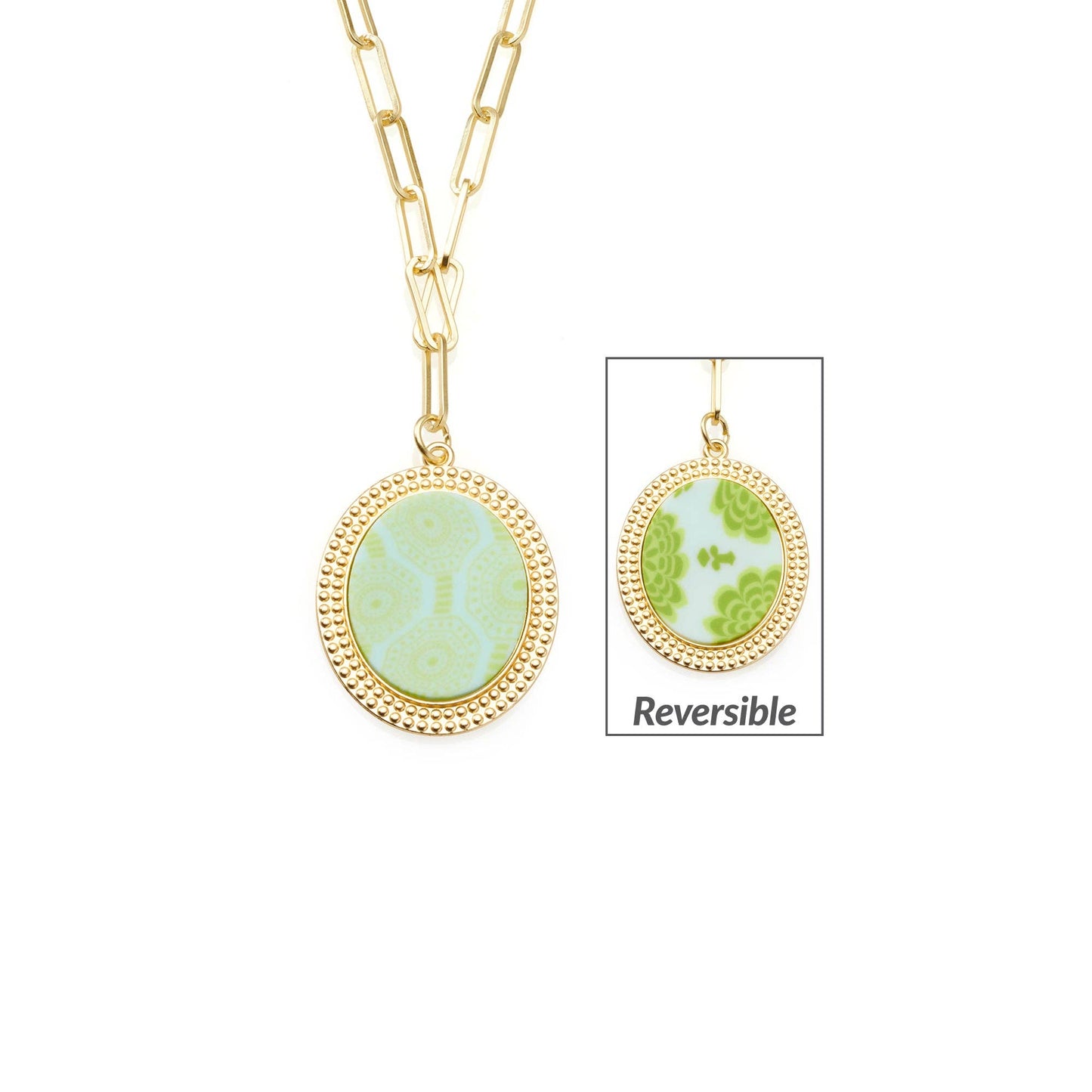 **Seaside Green Reversible Link Medallion Necklace**

- Oval pendant with reversible design
- Front: Seaside Green pattern with circular motifs
- Reverse: Abstract shapes in Maui Blue
- Sizes available: One size

Features a small inset image to highlight the reversible functionality, offering versatile style options.