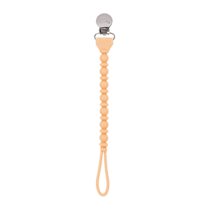 A Hero Blue Beaded, Sweetie Strap™ Silicone One-Piece pacifier clip with a series of round beads forming a spiral design, and a metal clasp at the top for attachment.