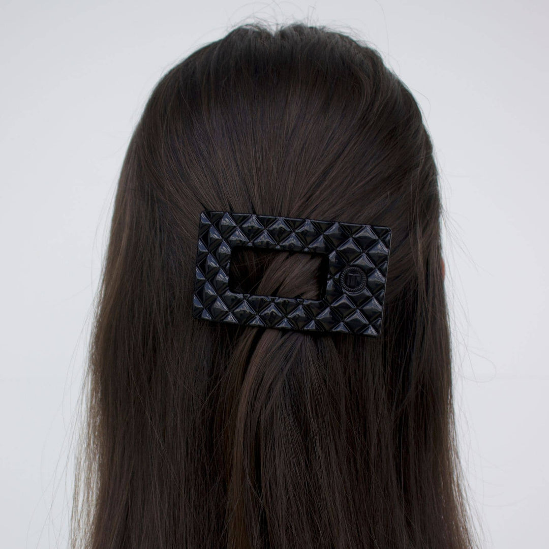 Large black TELETIES Flat Rectangle Hair Clip shown securing hair; available in multiple sizes.