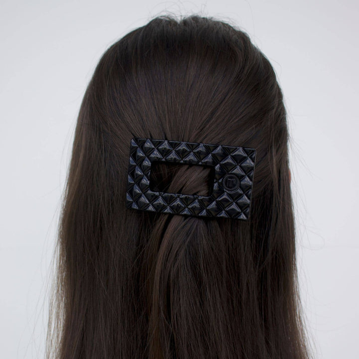 Large black TELETIES Flat Rectangle Hair Clip shown securing hair; available in multiple sizes.