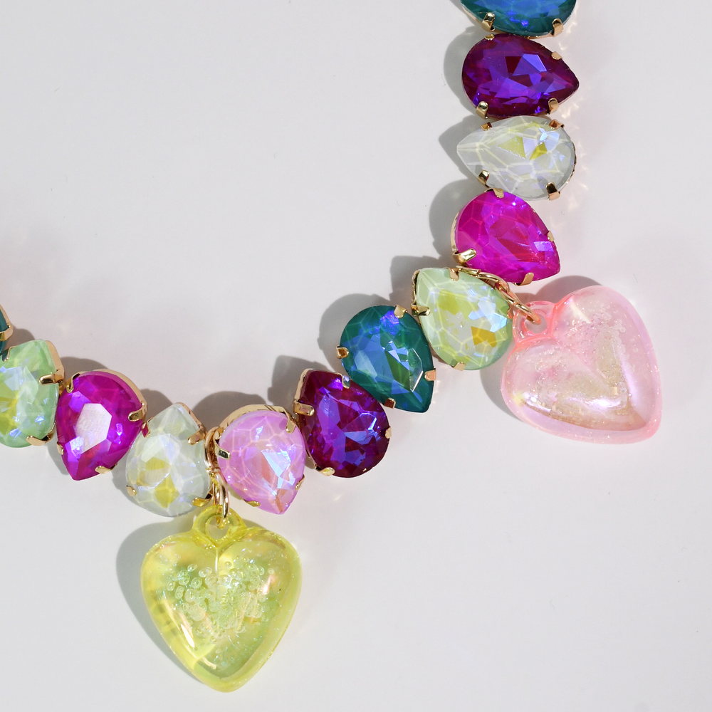 Colorful necklace with faceted teardrop beads and two large heart charms in pink and yellow. Available in S, M, L sizes.
