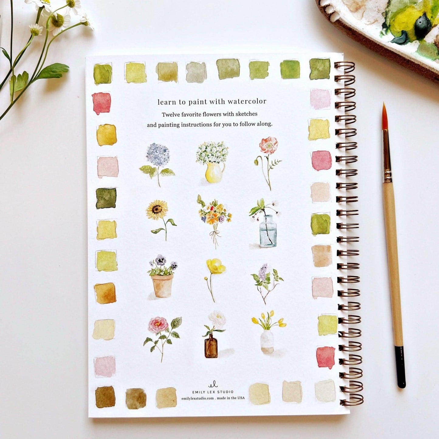 The Flowers Watercolor Workbook: beginner tips, 12 flower sketches, swatches, paintbrush, palette. Size info not provided.