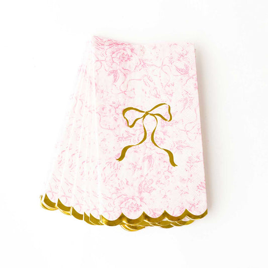 Pink Bow Toile Paper Guest Towel Packs with pink florals, gold bow center, foil scalloped edges. Sizes: standard guest towel.