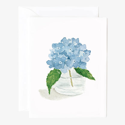 Set of 8 notecards with watercolor blue hydrangeas in glass vase; green leaves. Sizes available: standard notecard.