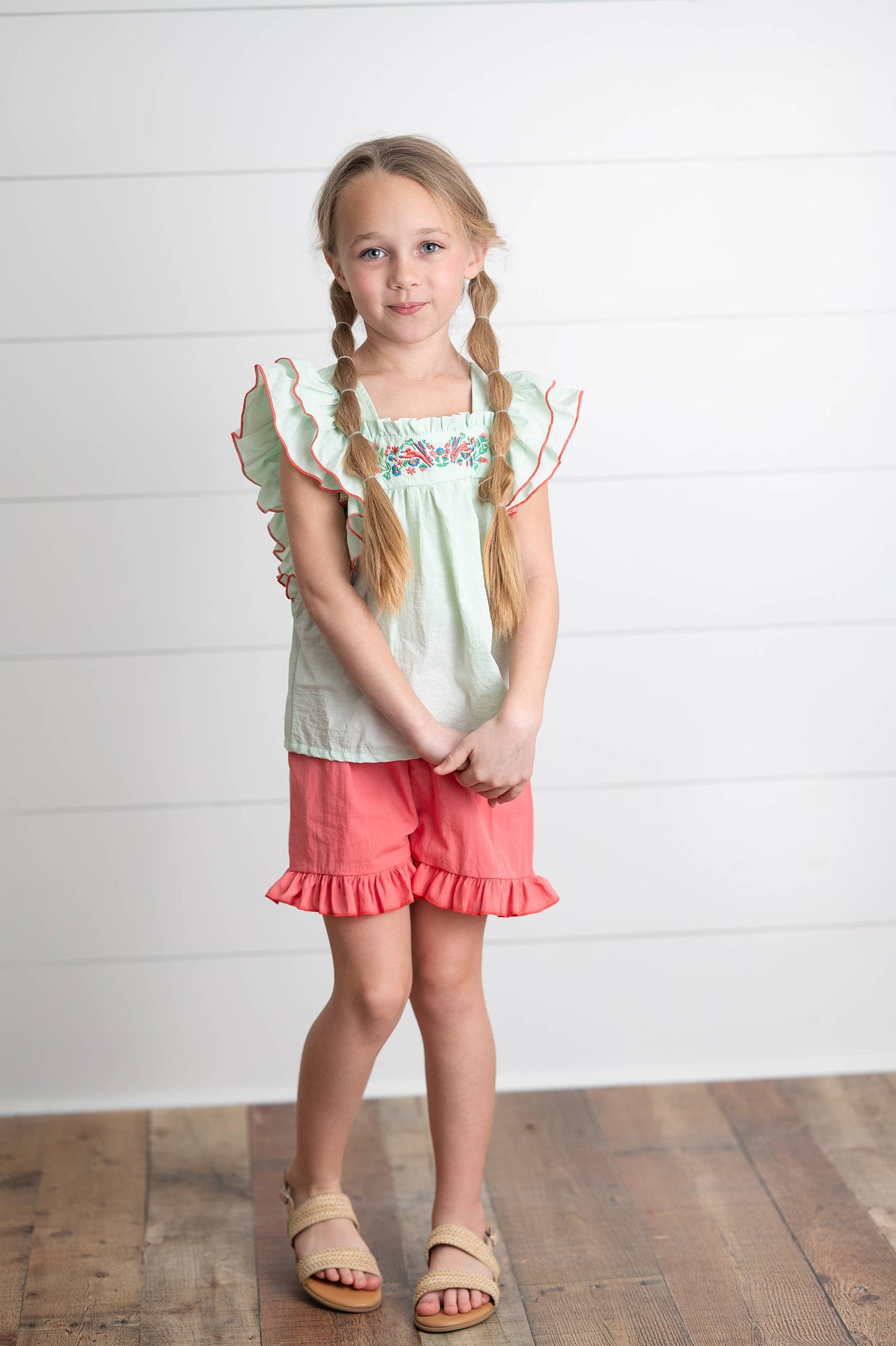 Girls Embroidered Mint Ruffle Top & Pink Short Set with ruffled details; sizes available: 2T-8.