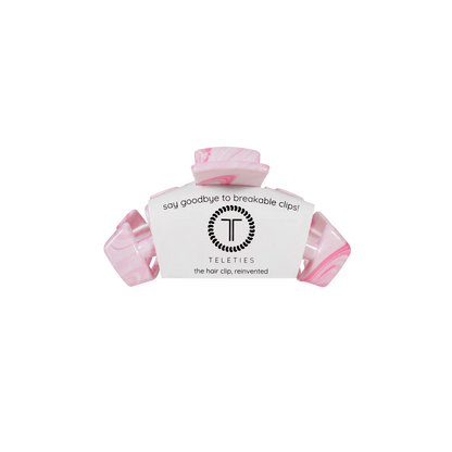 Pink marbled Classic Tiny Claw Clip with white label. Available sizes: tiny. Text: "say goodbye to breakable clips!.