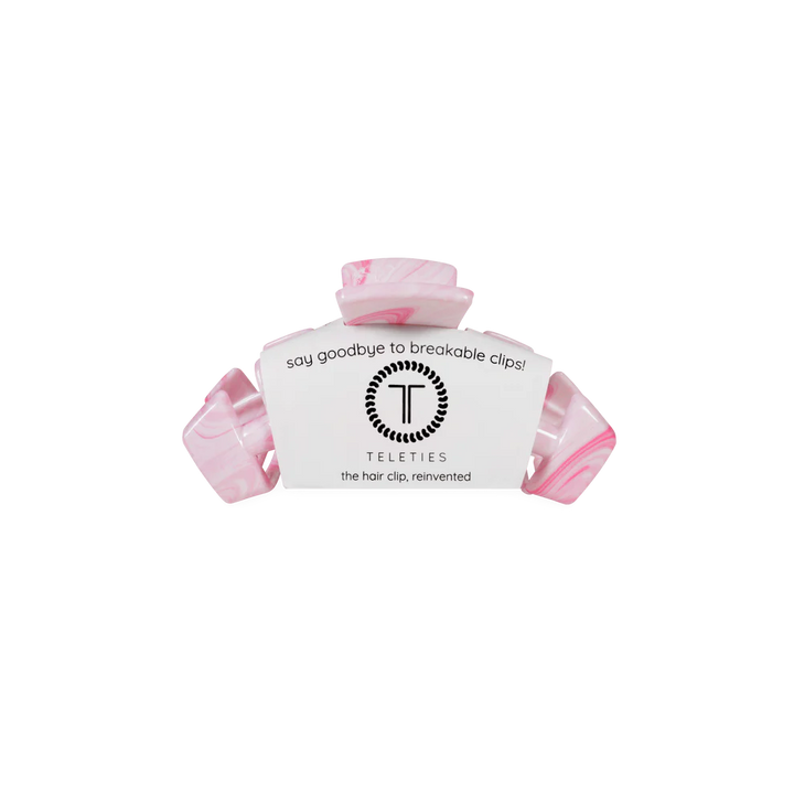 Pink marbled Classic Tiny Claw Clip with white label. Available sizes: tiny. Text: "say goodbye to breakable clips!.