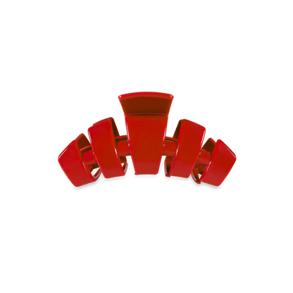 Red plastic Tiny Claw Clip with wide, curved prongs. Available in small sizes. Durable for everyday hair styling.