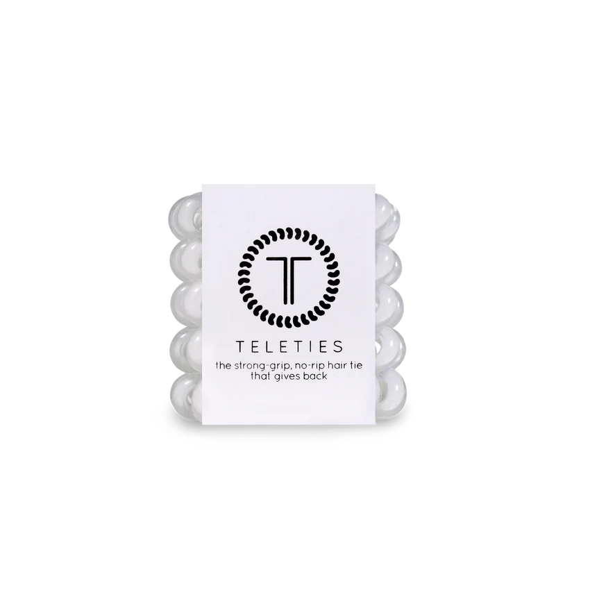 A compact stack of white coil-style TELETIES Hair Ties in clear packaging with sizes available: Small, Large.