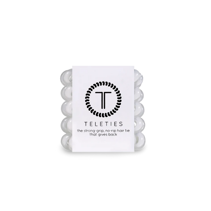A compact stack of white coil-style TELETIES Hair Ties in clear packaging with sizes available: Small, Large.