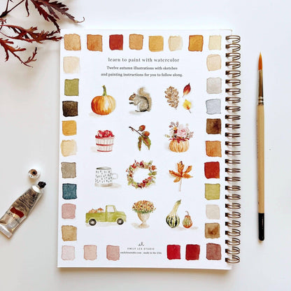 Open Autumn watercolor workbook, autumn designs, paint swatches on edges. Available sizes: A4, A5.
