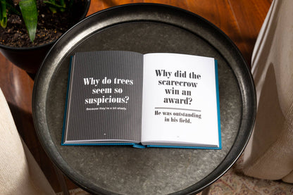 Open hardcover "World’s Greatest Dad Jokes: The Complete Collection" book showing inside pages; size options available.