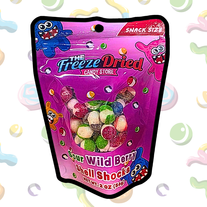 Bright pink 4 oz pouch labeled "Freeze Dried Shell Shocks: Sour Wild Berry" with cartoon blue characters, contains fruity candies.