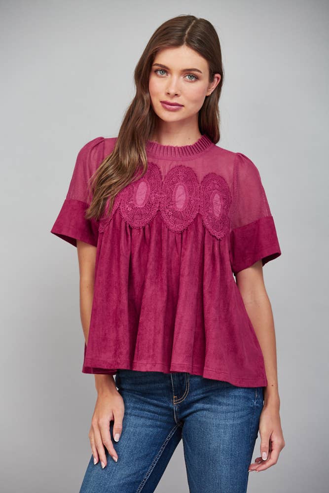Teal blue short-sleeved faux suede top with sheer mesh yoke and lace applique trim.