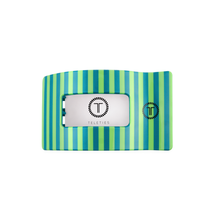 The Cabana Cutie Flat Rectangle Hair Clip is a medium-sized, rectangular hair clip with teal and green vertical stripes, a cut-out center, and the TELETIES logo in black on white.