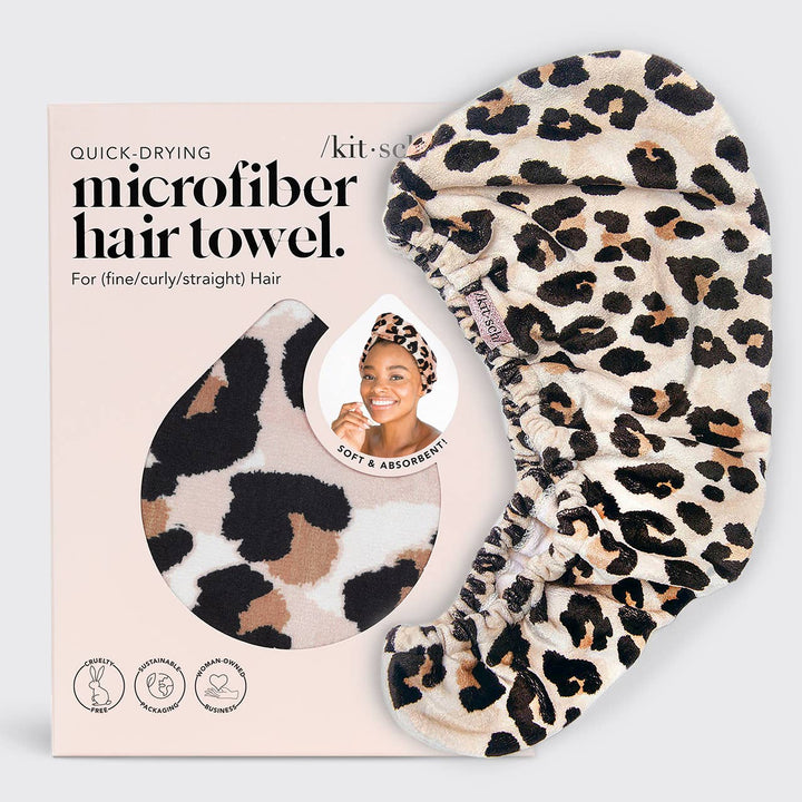 Quick Dry Hair Towel - Leopard print beside its box; packaging shows pattern cutout. Absorbent, reduces frizz. Sizes: S/M/L.