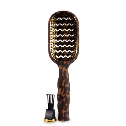 The Vented Hair Brush | Tortoise has a quick-heating aluminum plate, gold vented paddle, and textured tortoiseshell-patterned handle. Available in multiple sizes.