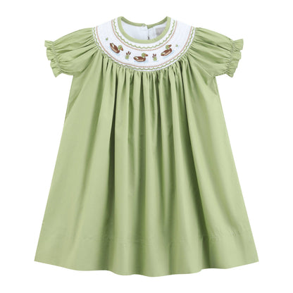 Pistachio green short-sleeve bishop dress with gathered full skirt, ruffled sleeves, and a smocked white collar featuring embroidered mallard ducks, small flowers, and green leaves. Available in sizes 2T-6.